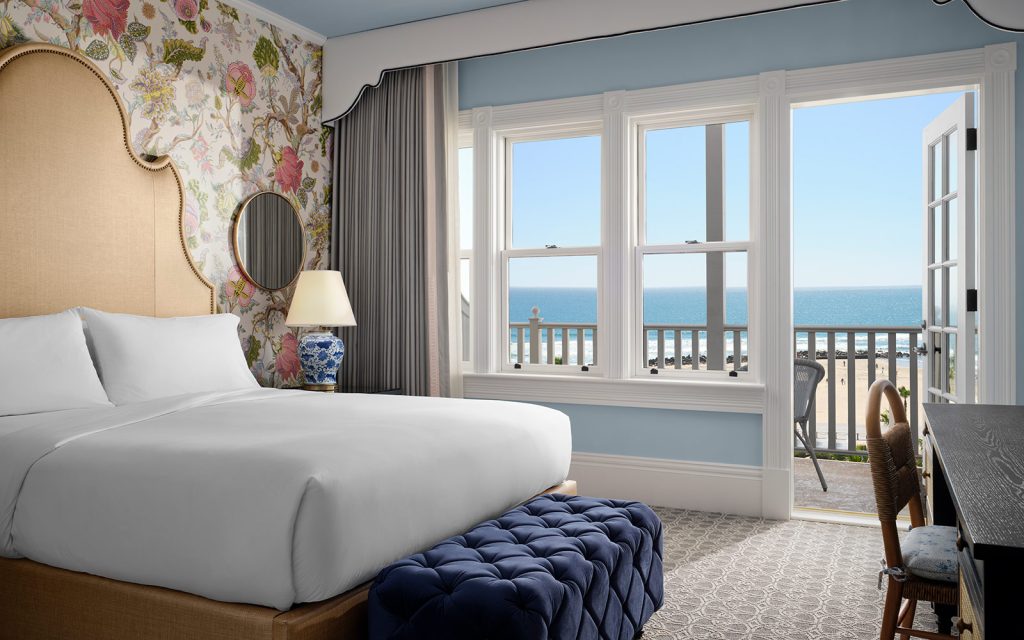 Oceanfront Victorian guest room with king bed and balcony