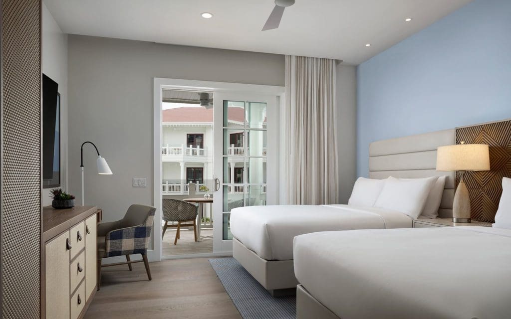 Bedroom with 2 queen beds and access to the veranda.